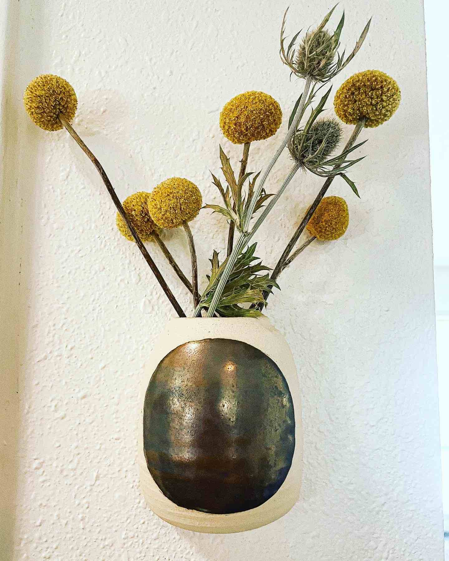 stoneware wall hanging vase in white stoneware with bronze circle by hey moon ceramics