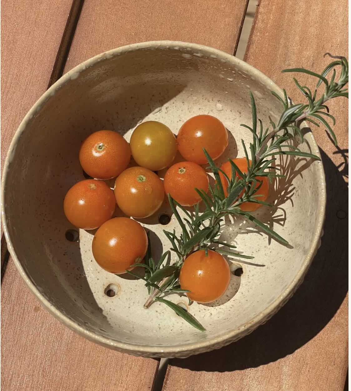 Berry bowl made by Hey Moon Ceramics with grape tomatoes and rosemary.