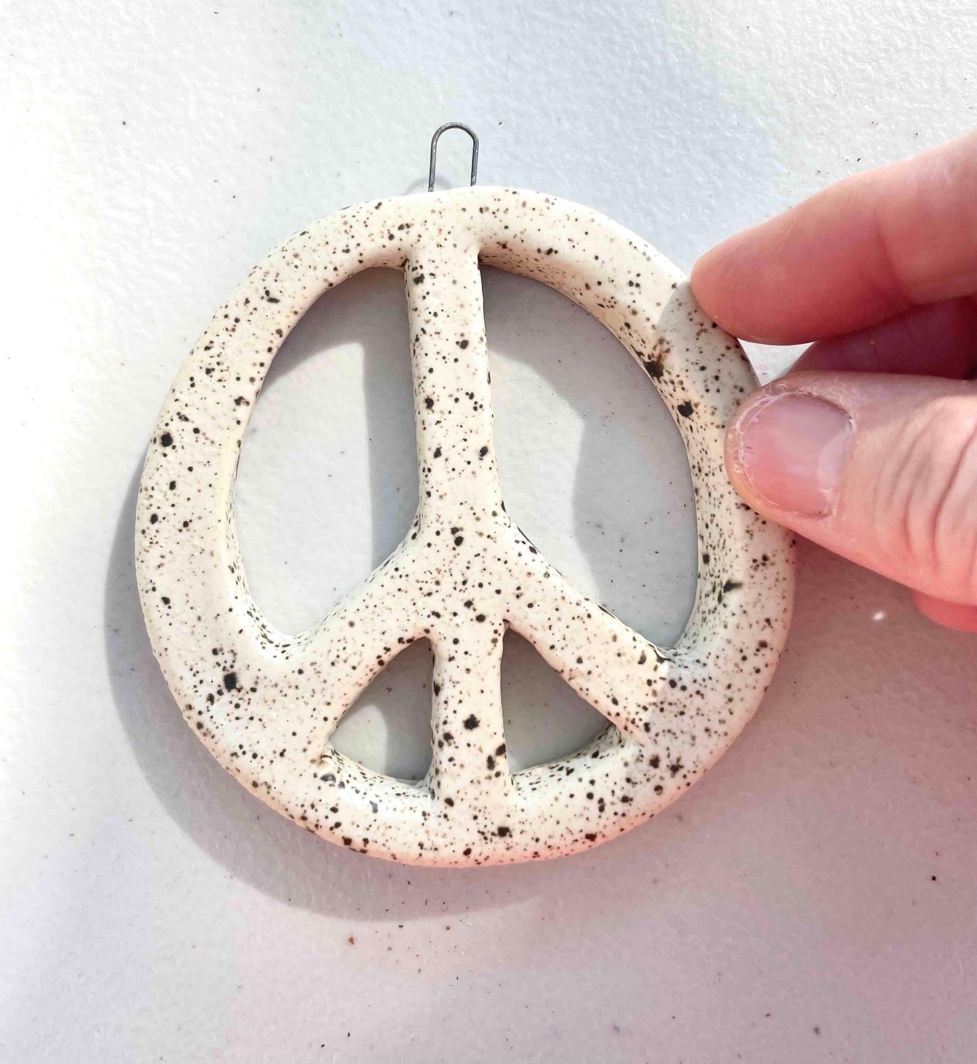 peace symbol ornament or wall hanging by Hey Moon Ceramics in white stoneware