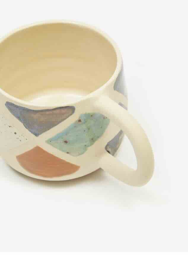 stoneware mug with handpainted multicolor terrazo rock detail by Hey Moon Ceramics
