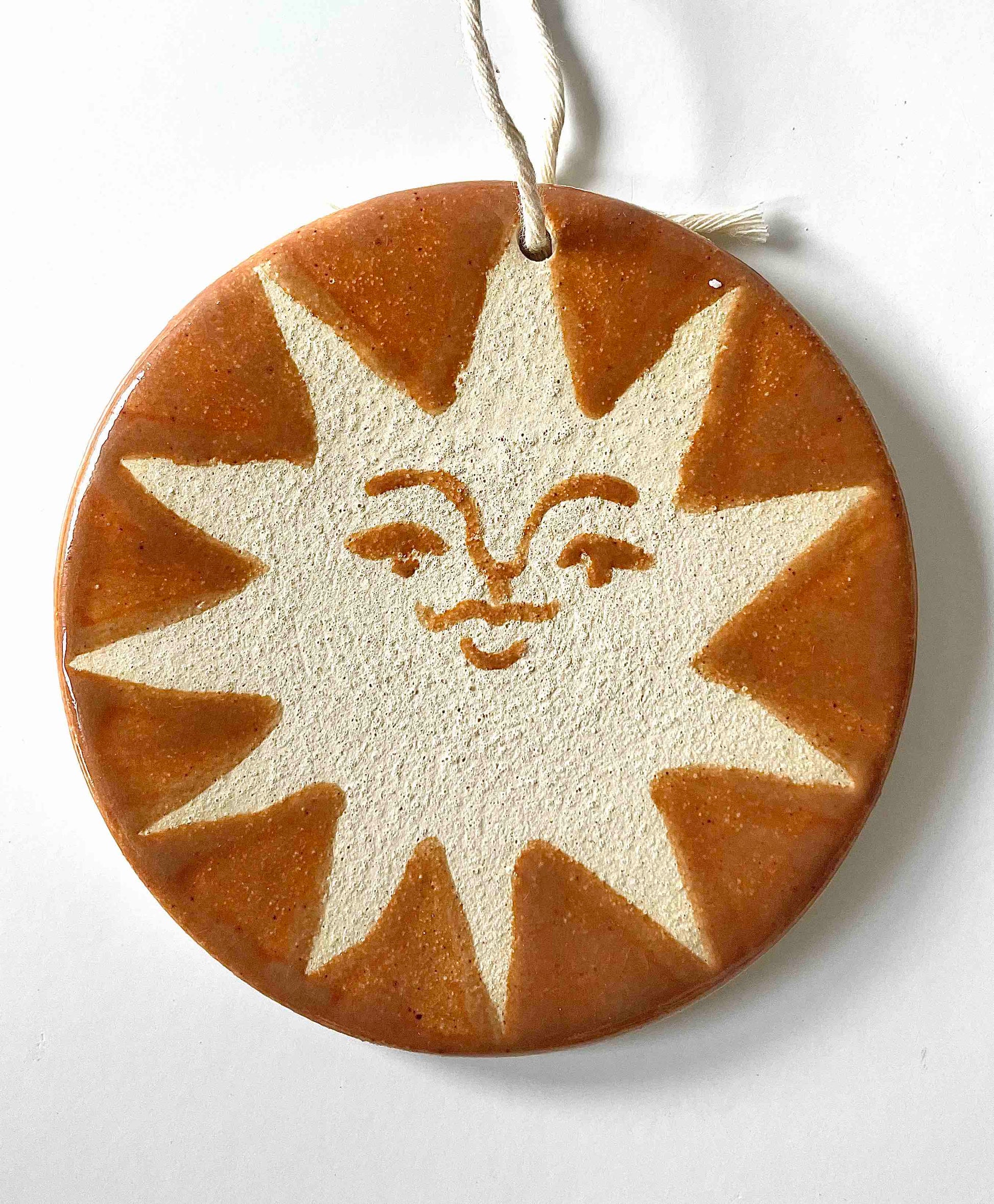 stoneware ornament with sun face in orange - Hey Moon Ceramics